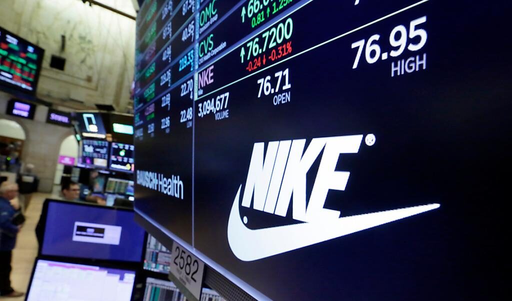 Wall Street trading floor traders screens index correction artificial intelligence semiconductor stocks nike fall