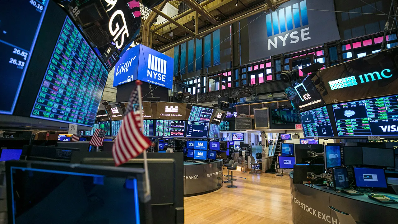 New York Stock Exchange traders floor empty trading screens s&p index charts down tech profit taking